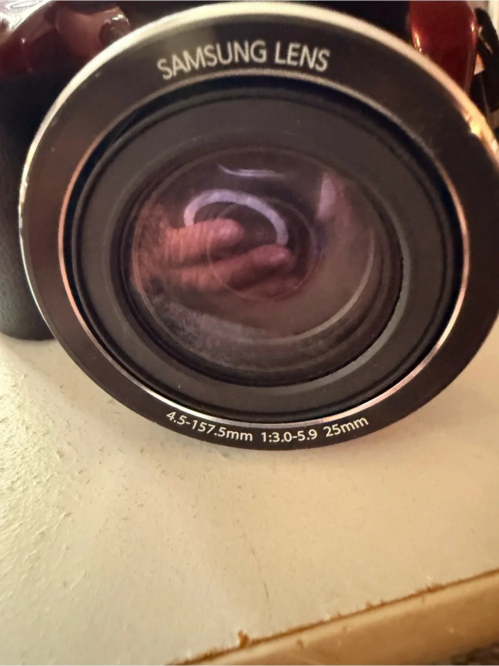Samsung glossy red digital bridge camera with Samsung lens